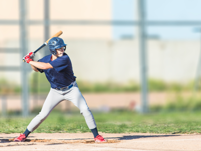 boy wearing his batting gloves 