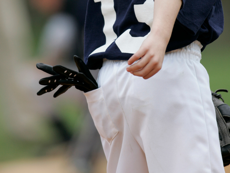 batting gloves in boy's pocket