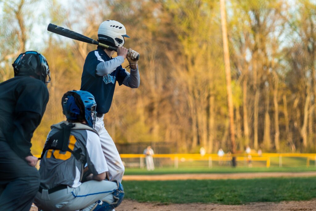 batter hitting the baseball