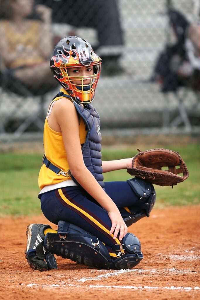 woman wearing baseball helmet