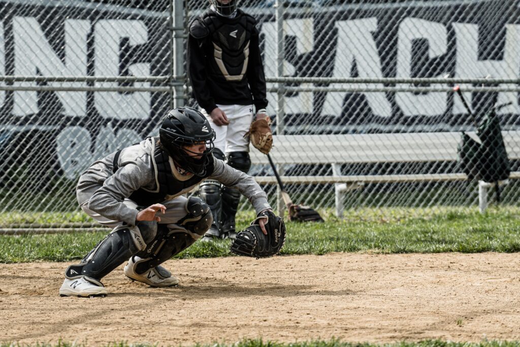 catcher wearing her baseball helmet